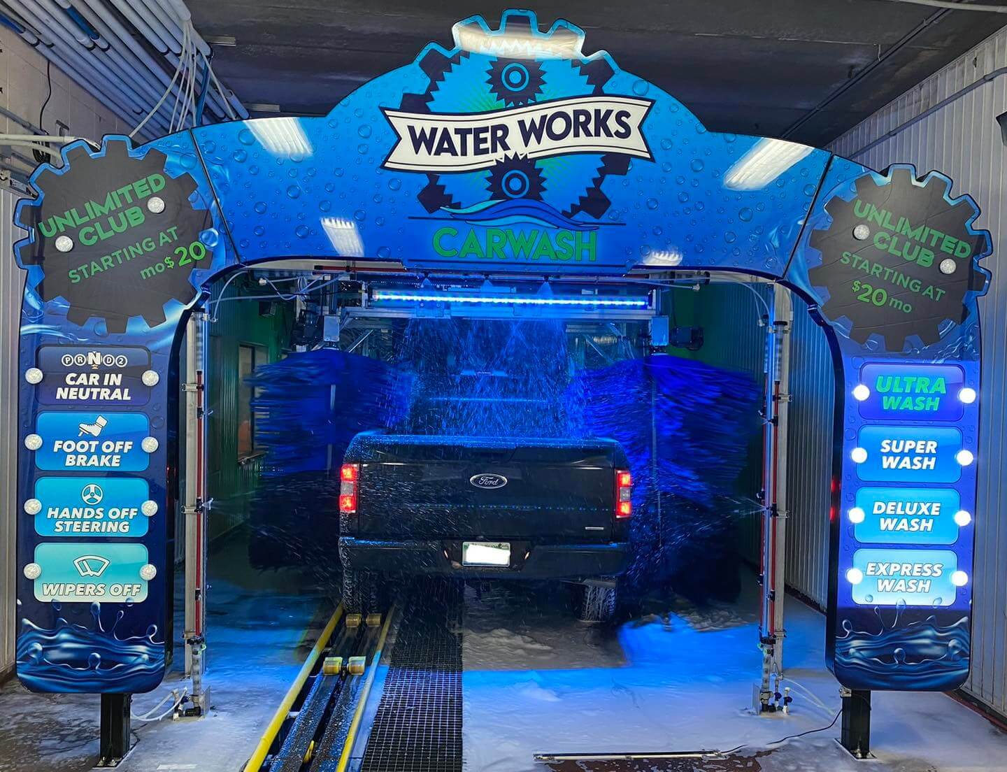 A truck moving through the Water Works wash tunnel